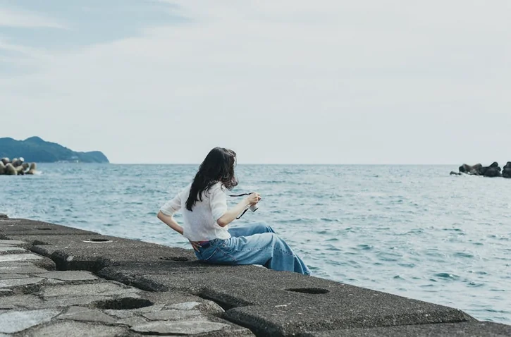 Serene moment by the sea at Nishi-Izu, capturing relaxation and tranquility.
