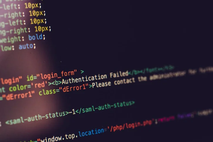 Close view of computer screen displaying HTML code with an authentication error.