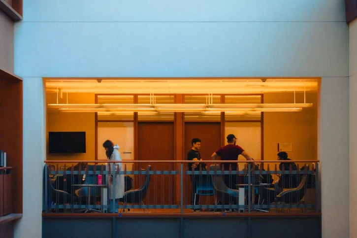 Business meeting in modern office space.