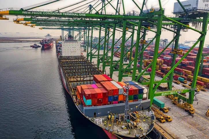Container ship loading at New Priok Container Terminal in North Jakarta, showcasing the bustling industrial port.