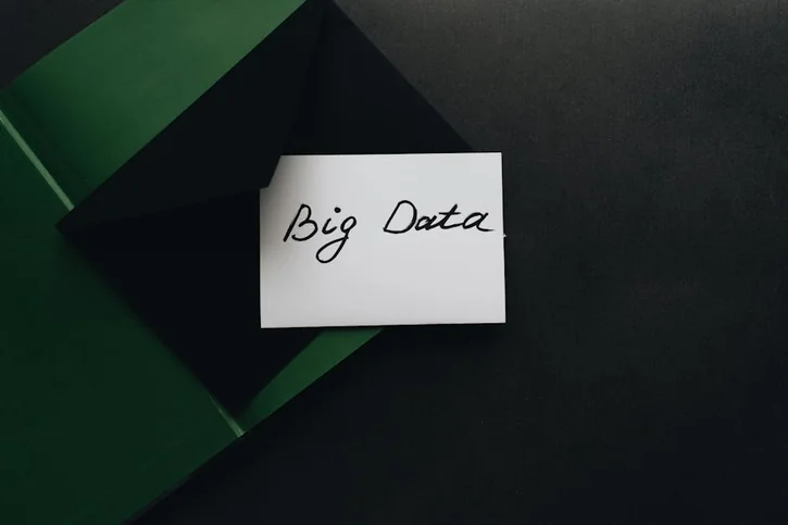 A minimalist photo of a card with 'Big Data' text inside a green envelope, showcasing modern concepts.